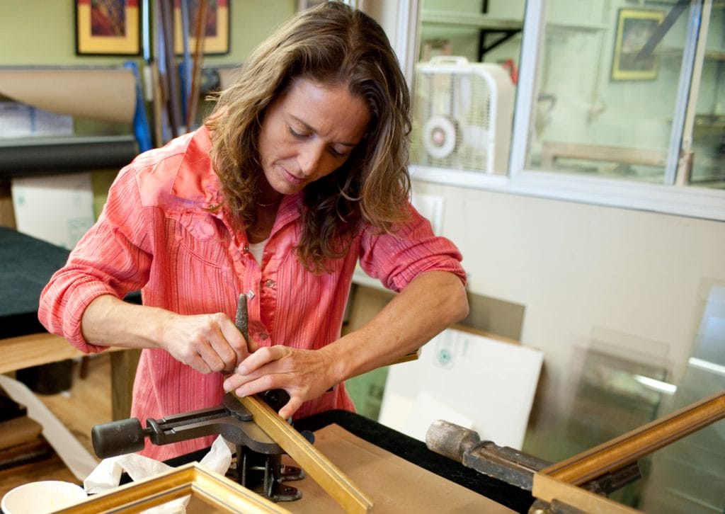 Susan Mowery working on constructing a frame in our TROSA Frame Shop