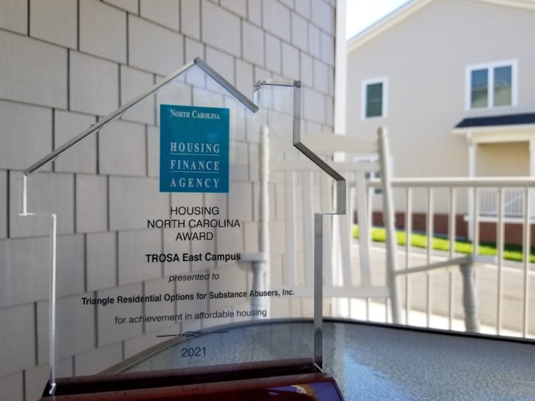Photo of TROSA's award for best supportive housing