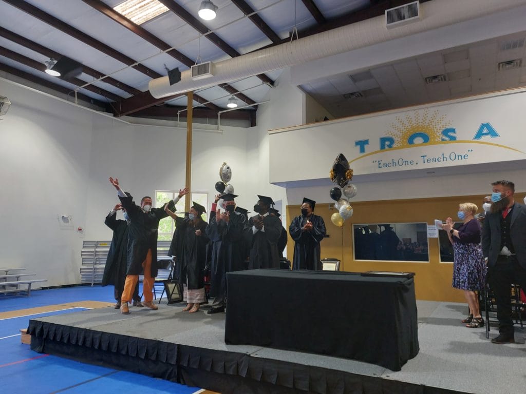 TROSA Graduates celebrating on stage